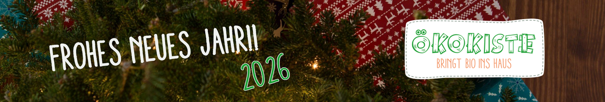 KI generiert: Weihnachtlich dekorierter Hintergrund mit Text: "FROHES NEUES JAHR!! 2026" und "ÖKOKISTE BRINGT BIO INS HAUS".
