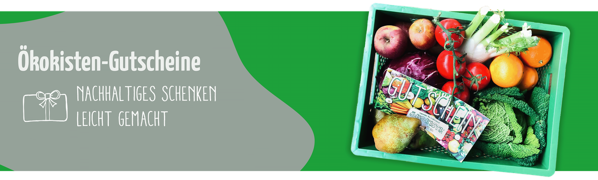 Das Bild zeigt eine grüne Kiste, die mit frischem Obst und Gemüse gefüllt ist, sowie einen Gutschein. Links daneben steht der Text "Ökokisten-Gutscheine – Nachhaltiges Schenken leicht gemacht".